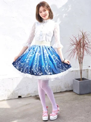 Celestial blue starfish lolita skirt front three-quarter view worn with white lace blouse outdoor courtyard setting