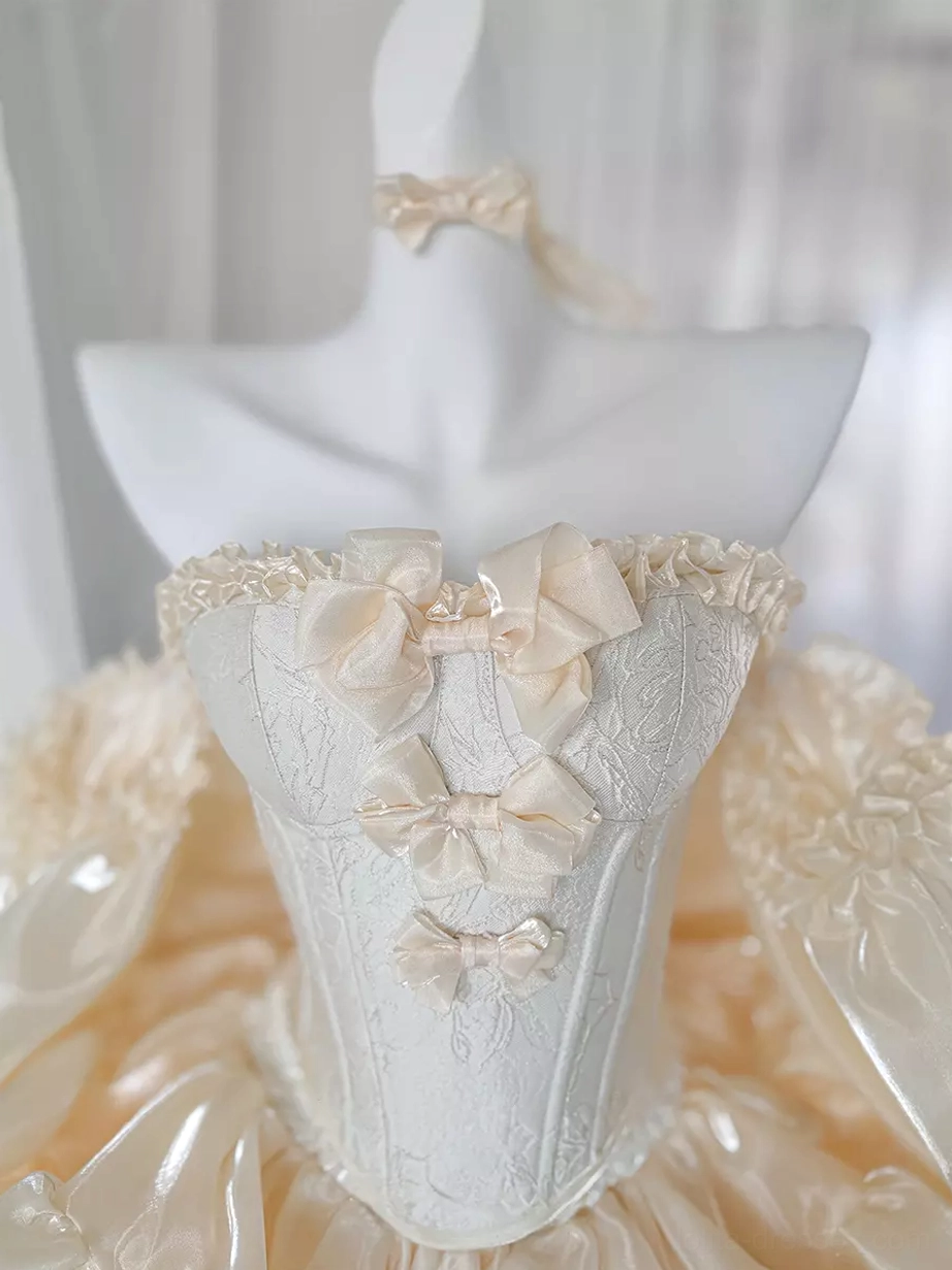 Champagne ballet-inspired sweet lolita dress with delicate ruffles, bow accents, strapless silhouette, and fairy tale aesthetic