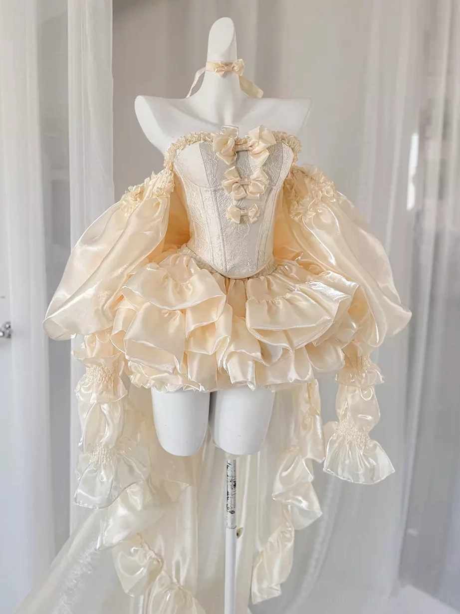 Champagne ballet lolita dress with ruffled train front three-quarter view on dress form, strapless corset bodice with bow embellishments and layered ruffles