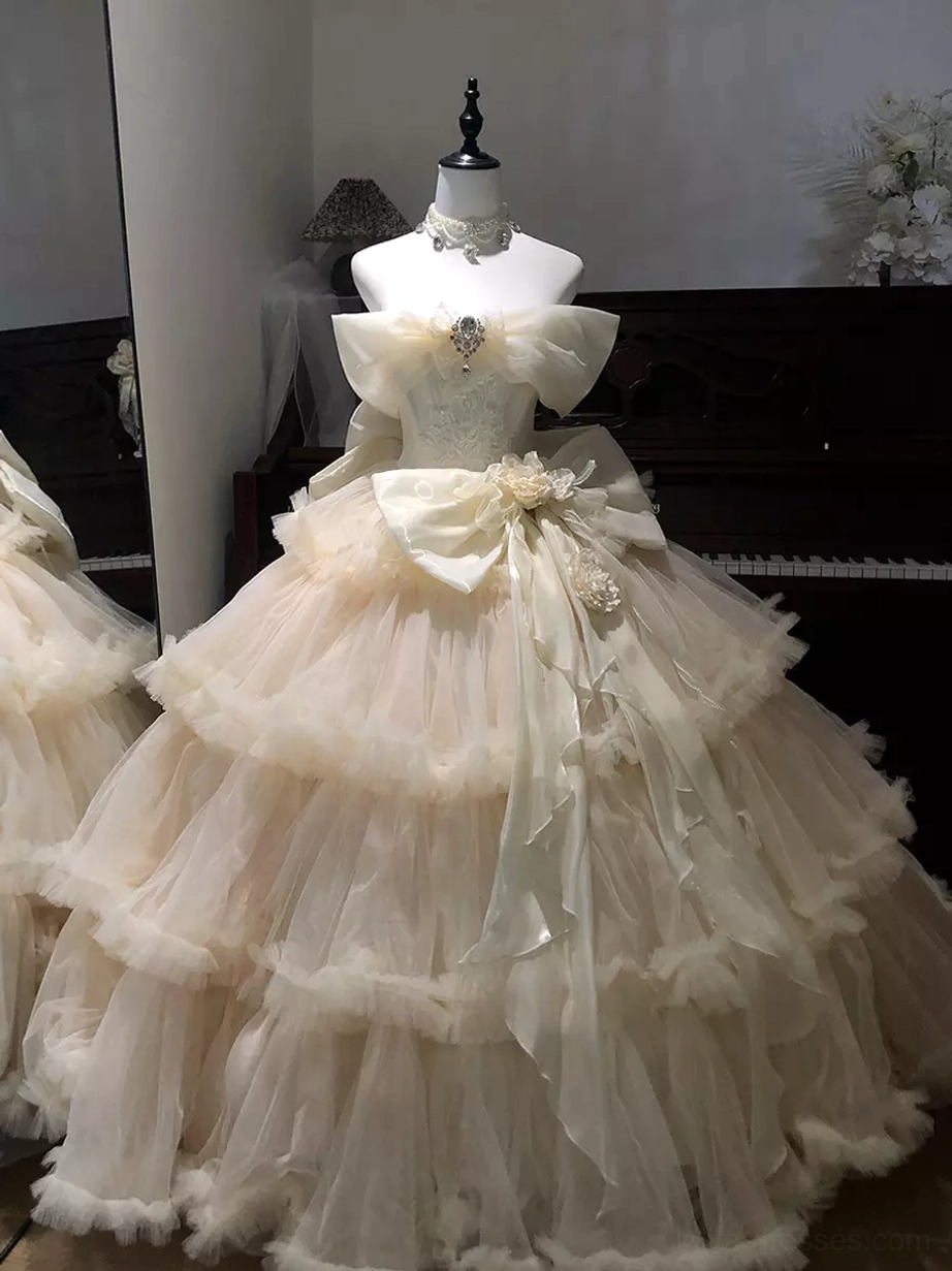Champagne lolita bridal dress with lace bodice ornamental waist bow and neck choker detail centered front view
