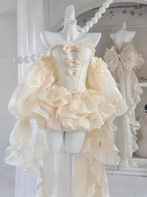 Strapless champagne lolita dress with oversized ruffled sleeves, corset bust detail, and sweeping floor-length trained skirt, front three-quarter studio view