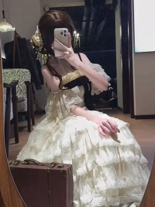 Champagne off-shoulder layered lolita fairy dress with lace tulle skirt and flower hair ornament, girl taking mirror selfie indoors, showing cozy sweet aesthetic styling