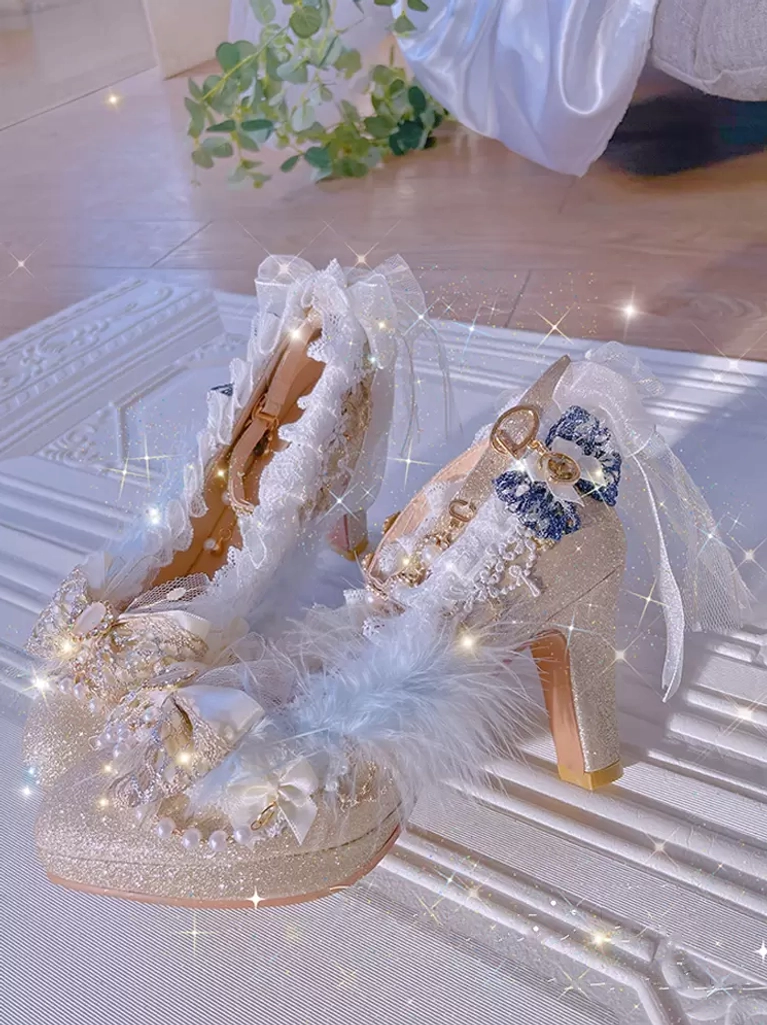 Champagne glitter lolita chunky heel pumps overhead flat lay showcasing pearl accents, blue bows, lace ruffles, and feather trims on white platform