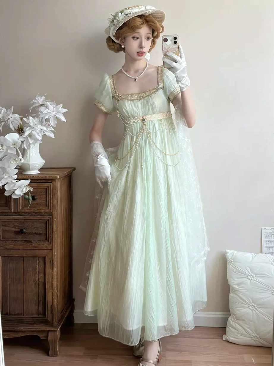 Light gold variant Regency Lolita dress front view with square puff sleeves, empire waist, decorative chains, champagne fabric, sweet Lolita style