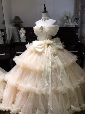 Champagne sweet lolita wedding ball gown with off-shoulder ruffled collar and tiered tulle skirt front view mannequin