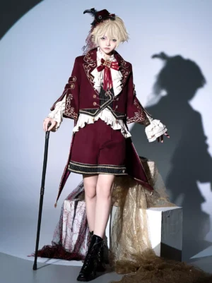 Royal Crimson Christmas Prince Lolita formal set featuring full-body front view with wine-red tailored overcoat, gold embroidery, ruffled inner shirt, black ankle boots, and decorative backdrop with theatrical tulle accents