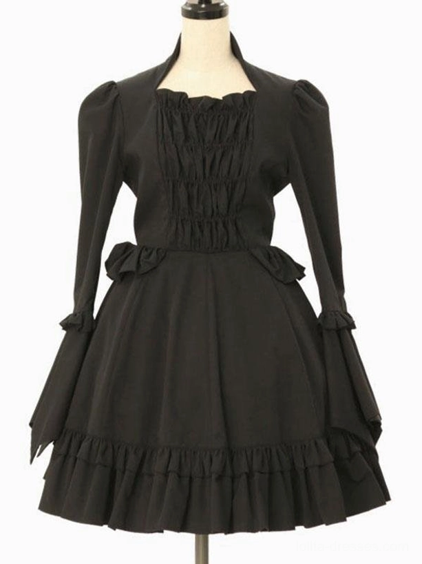 Classic black lolita dress full front view featuring puffed long sleeves, ruffled cuffs, ruched bust bodice, waist bow details, and ruffled hem on headless mannequin