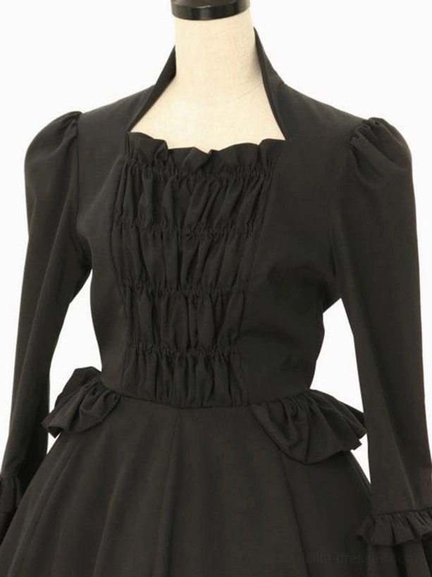 Classic black lolita dress upper body close-up showing square stand collar, ruched front bodice, puffed sleeve construction, and side waist decorative elements
