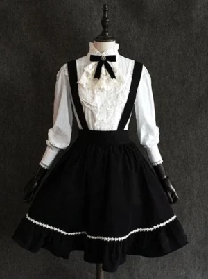Classic lolita black chiffon skirt angled front view showing adjustable suspender straps and high-contrast black and white retro lolita aesthetic