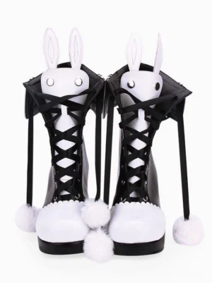 Pair of classic lolita bunny ear chunky heel boots with fluffy pom-pom tassels and sailor-style collar details, overhead flat lay