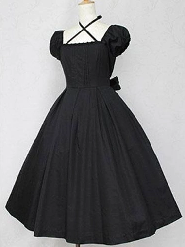 Classic Lolita cotton OP dress pure black color front view displaying structured pleated bodice puff sleeves cross halter design and Victorian-inspired silhouette