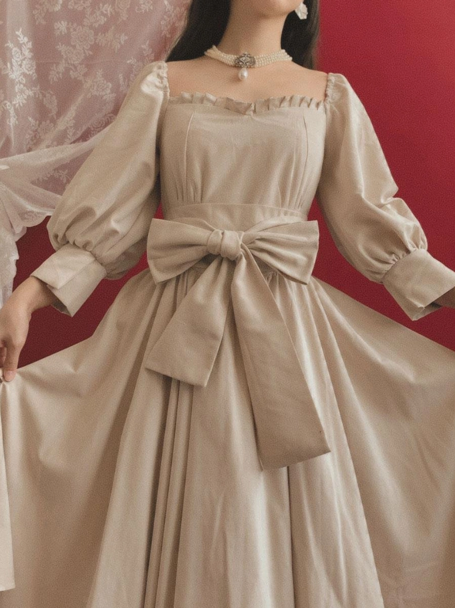 Detailed close-up of classic lolita dress front waist bow ruffled square neckline puff sleeves ecru vintage aesthetic