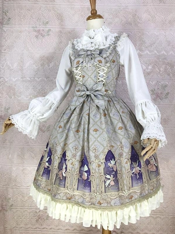 Grey sleeveless classic lolita jumper dress with lace-up bodice waist bow cathedral fairy print cream ruffled hem three-quarter front view