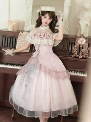 Vintage rose pink Classic Lolita dress front three-quarter view with lace yoke rose appliques and sheer short sleeves in retro piano studio