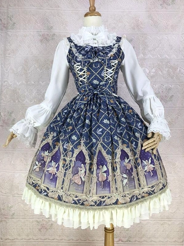 Dark blue sleeveless lolita dress with diamond lattice pattern and cathedral fairy print cream ruffled hem three-quarter front view