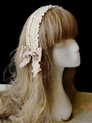 Classic Lolita lace headdress with cream beige lace trim and satin bow accent displayed on mannequin head, right side profile view showcasing elegant Victorian-inspired design
