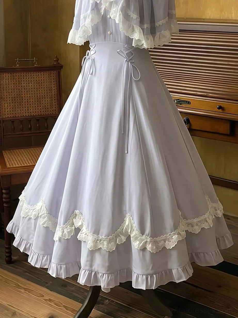 Low side view of lavender classic lolita dress showing ruffled scalloped lace border hem, dual drawstring waist structure, partial lace capelet detail, and romantic maxi silhouette