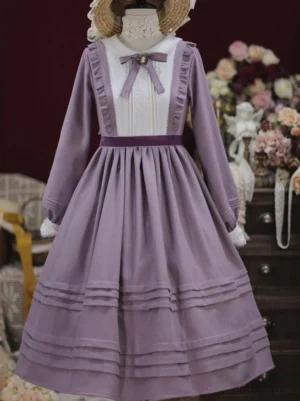 Classic lolita long sleeve dress with mauve purple color and white front yoke, featuring delicate bow necktie and tiered pleated skirt - front full body view