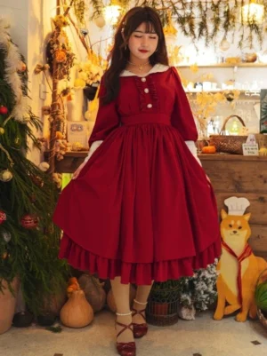 Classic red long-sleeve Lolita dress with white doll collar and ruffled front placket worn by model in vintage indoor shop setting