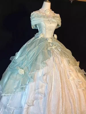 Off-shoulder classic lolita dress mint blue cream white layered skirt with floral bow decorations on mannequin dark starry backdrop