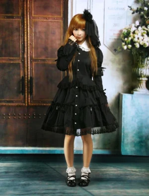 Black lolita one-piece dress front medium shot model hand near cheek front button closure ruffled collar