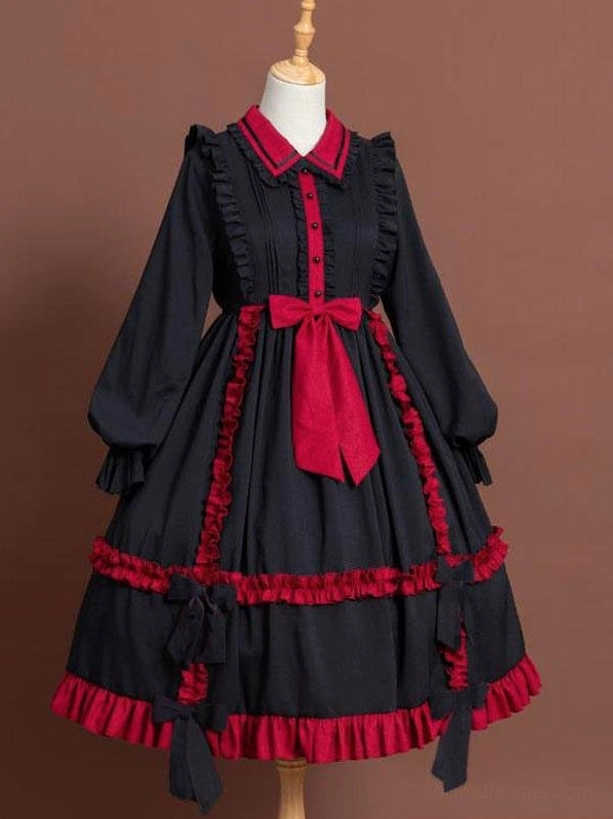 Two-tone classic Lolita OP dress front view with red bow and ruffled trims displayed on dress form mannequin