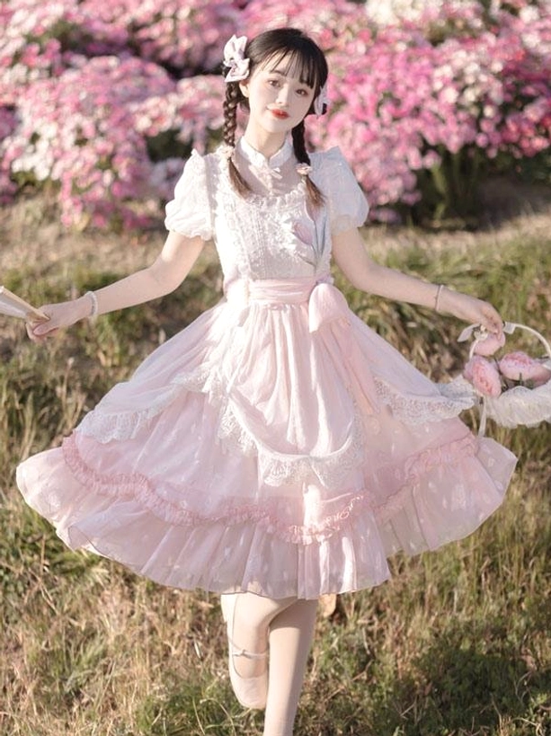 Pink classical lolita dress full front view puff sleeves ruffled hem flower basket outdoor flower field