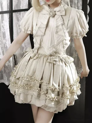 Classic lolita two-piece ensemble detail shot showing puffed short sleeves tiered ruffled lace-trimmed skirt design close-up