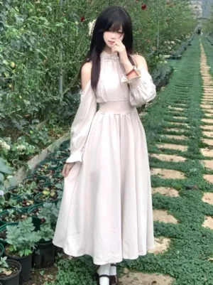 classic-sweet-lolita-pearl-halter-cold-shoulder-midi-dress-light-pink-side-view-garden-setting