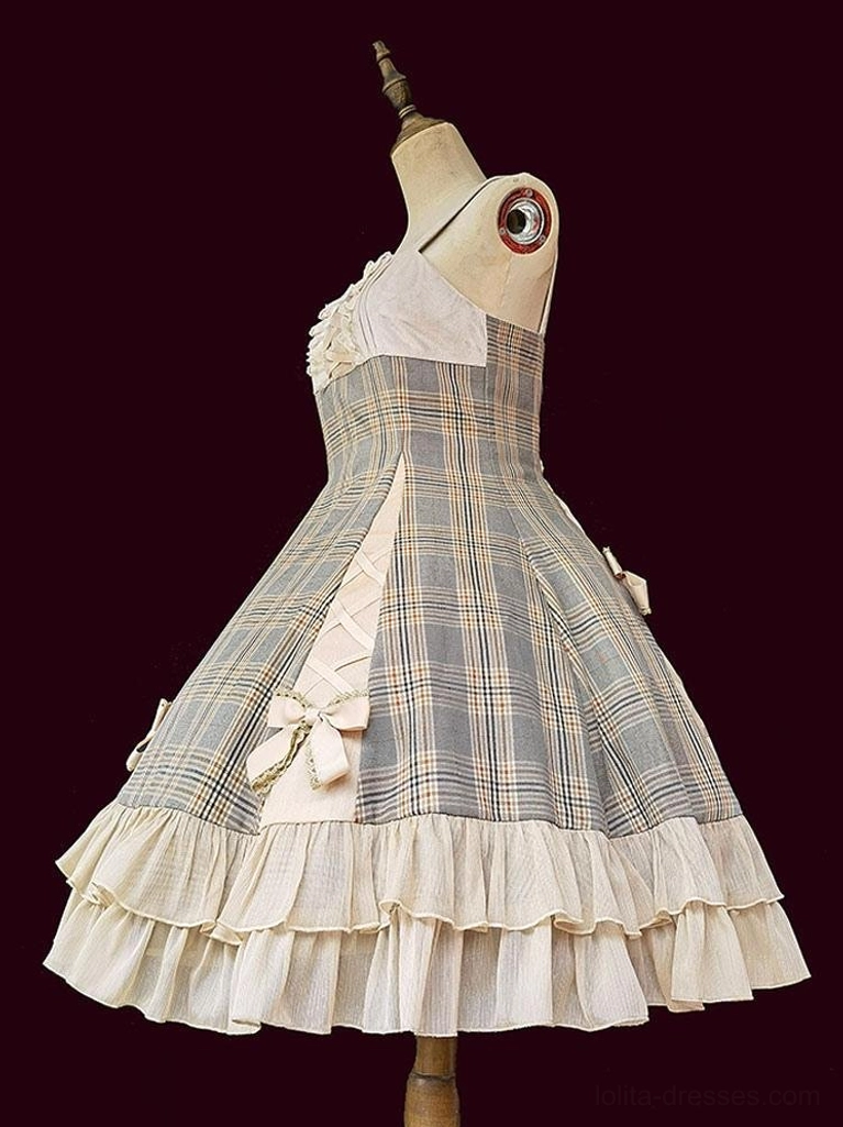 Classical Lolita JSK dress front three-quarter view on dress form, featuring asymmetrical neckline and tiered ruffled skirt hem