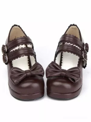 Coffee brown lolita Mary Jane block heels with double metal buckle straps and front bow decoration, direct front view on white background