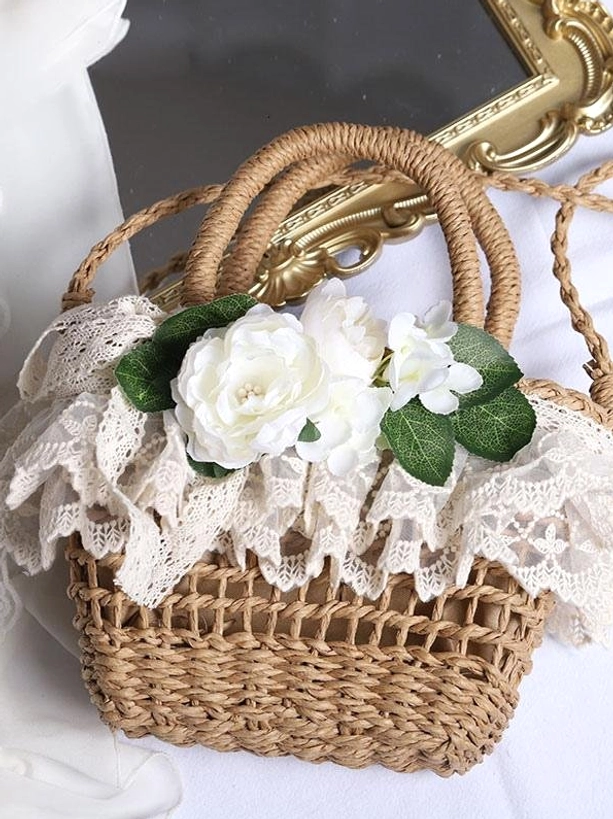 Coffee brown lolita straw handbag with lace ruffle and white flower embellishments front three-quarter view elegant aesthetic