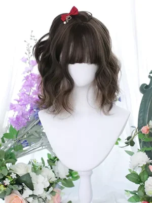 Coffee brown wavy bob lolita wig with blunt bangs displayed on white mannequin head, styled with red bow hair clip and light brown dimensional highlights, perfect for sweet lolita fashion coordinates and tea party outfits