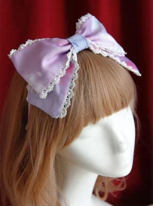 Cotton candy lolita headbow featuring purple-pink gradient organza with delicate white lace edging, right three-quarter perspective