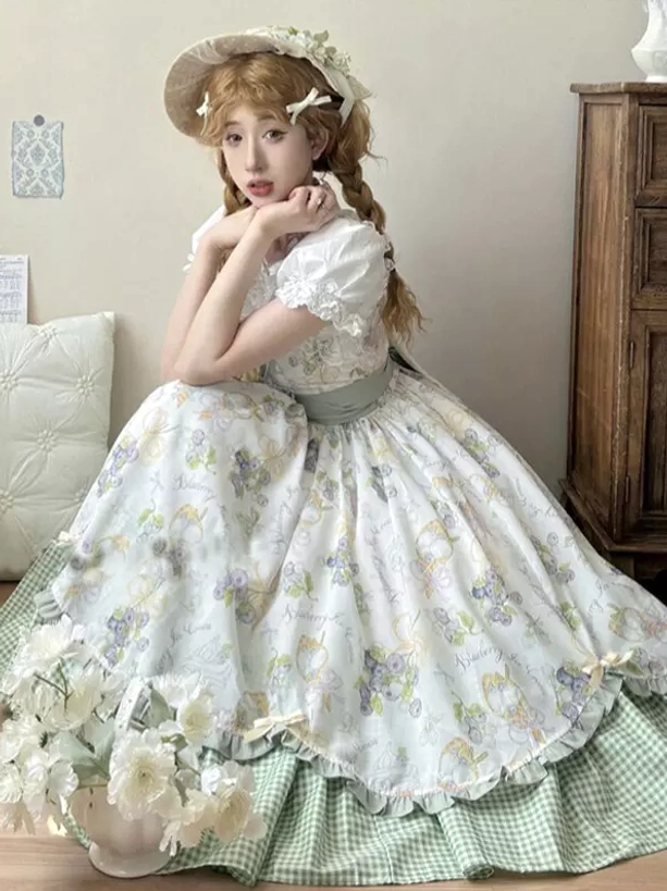 Country lolita OP dress sitting three-quarter view blonde girl indoor bedroom puffy sleeves green gingham underskirt
