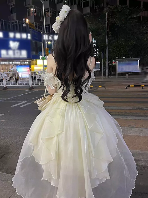 Cream off-shoulder lolita dress high-low silhouette tulle fabric ruffled back view long curly hair night street aesthetic sweet lolita