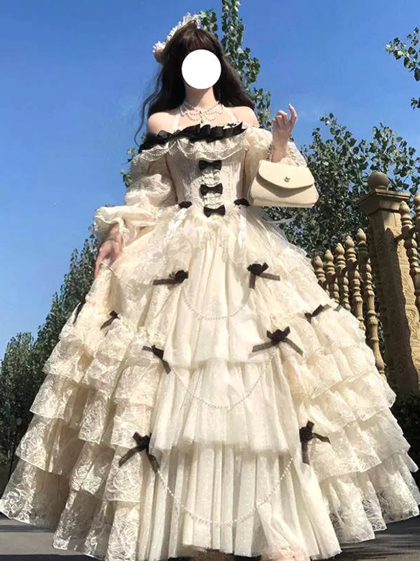 white cream off-shoulder lolita fairy gown with pearl chain trim black bows decorations full body front view model with beige handbag