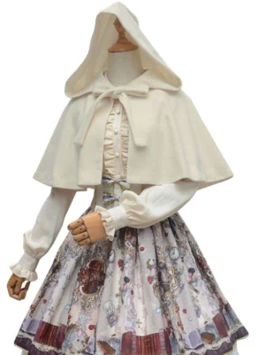 Cream colored lolita hooded capelet full front view on jointed doll wearing matching printed lolita dress, displaying hood construction and coordinated accessories with neck ribbon