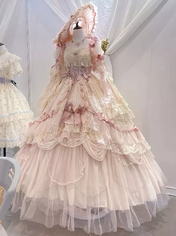 Cream pink formal lolita dress with feather adorned bonnet sleeveless lace bodice floor length tulle skirt