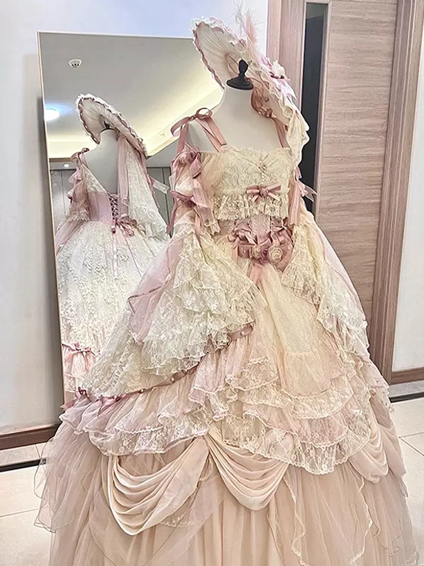 Cream pink royal lolita gown backless lace bodice layered ruffles matching feather bonnet three quarter view