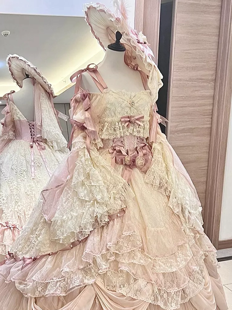 Cream pink vintage lolita dress corset top oversized layered lace skirt decorative feather bonnet detail view