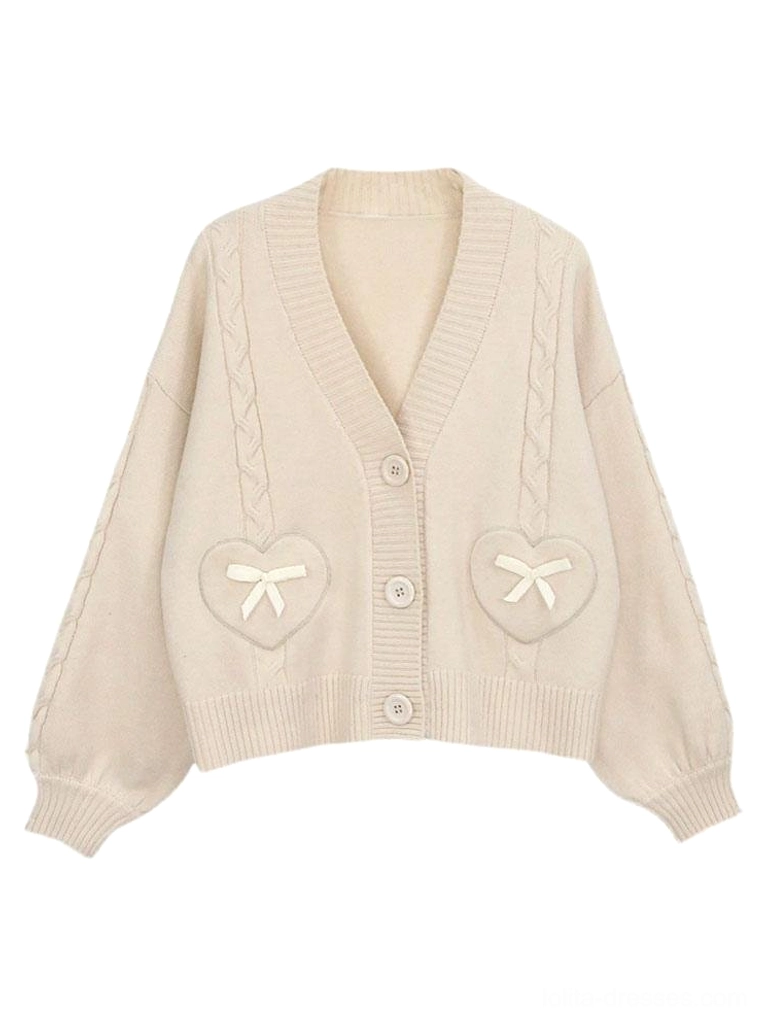 Cream white lolita cardigan sweater with heart-shaped bow pockets and front button placket flat lay product photography