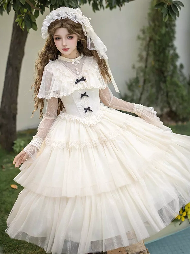 Three-quarter side view of cream white Lolita dress set featuring layered ruffled tiered tulle skirt, sheer long sleeves, and delicate bridal veil headpiece in outdoor yard