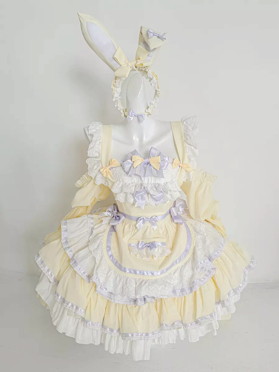 Cream yellow and purple rabbit maid lolita dress with tiered ruffled skirt worn on dress form, front view showing sweet maid aesthetic with color contrast trim