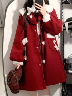 Crimson red lolita wool overcoat front view with white fuzzy collar and pom-pom pockets, worn with plaid skirt and matching beret in overhead selfie pose