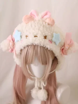 Close-up front view of pink lamb ear lolita sherpa hat displaying detailed embroidered cute face, pastel star and bow decorations, soft fleece texture, perfect for lolita coordinates