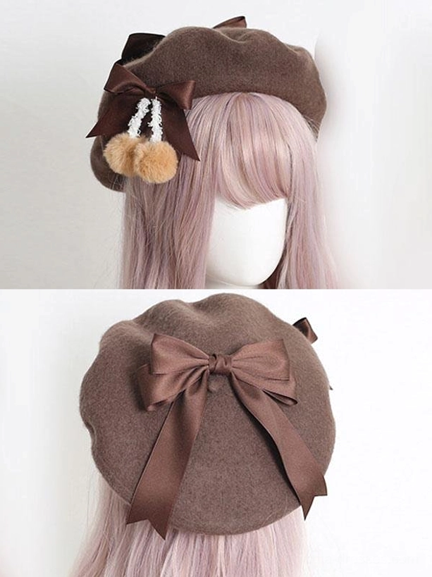 Dark brown lolita hat with satin bow accent and tan fuzzy pom-poms, side profile view
