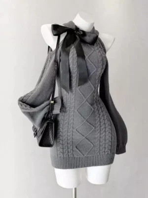 Dark gray cable knit sweet lolita cold shoulder mini dress with long sleeves displayed on mannequin, front oblique view showing rhombus knit texture pattern with black satin bow and crossbody bag