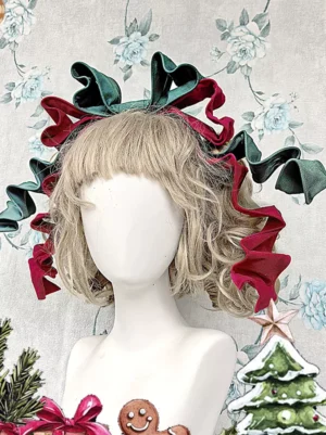 Dark green and wine red velvet bow lolita headdress with curled ribbon tails on mannequin with blonde curly wig, displayed against festive floral backdrop with Christmas ornaments