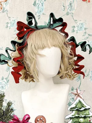Close-up front view of dark green and wine red velvet bow lolita headdress showing detailed curled ribbon tails and bow construction on blonde curly wig mannequin